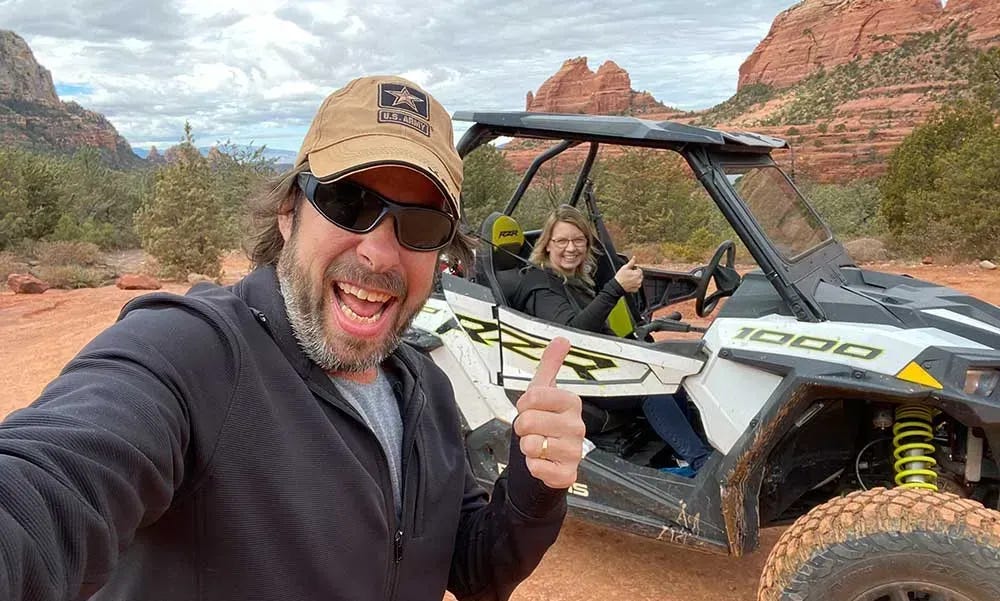 James and Donetta riding around in a Polaris RZR.
